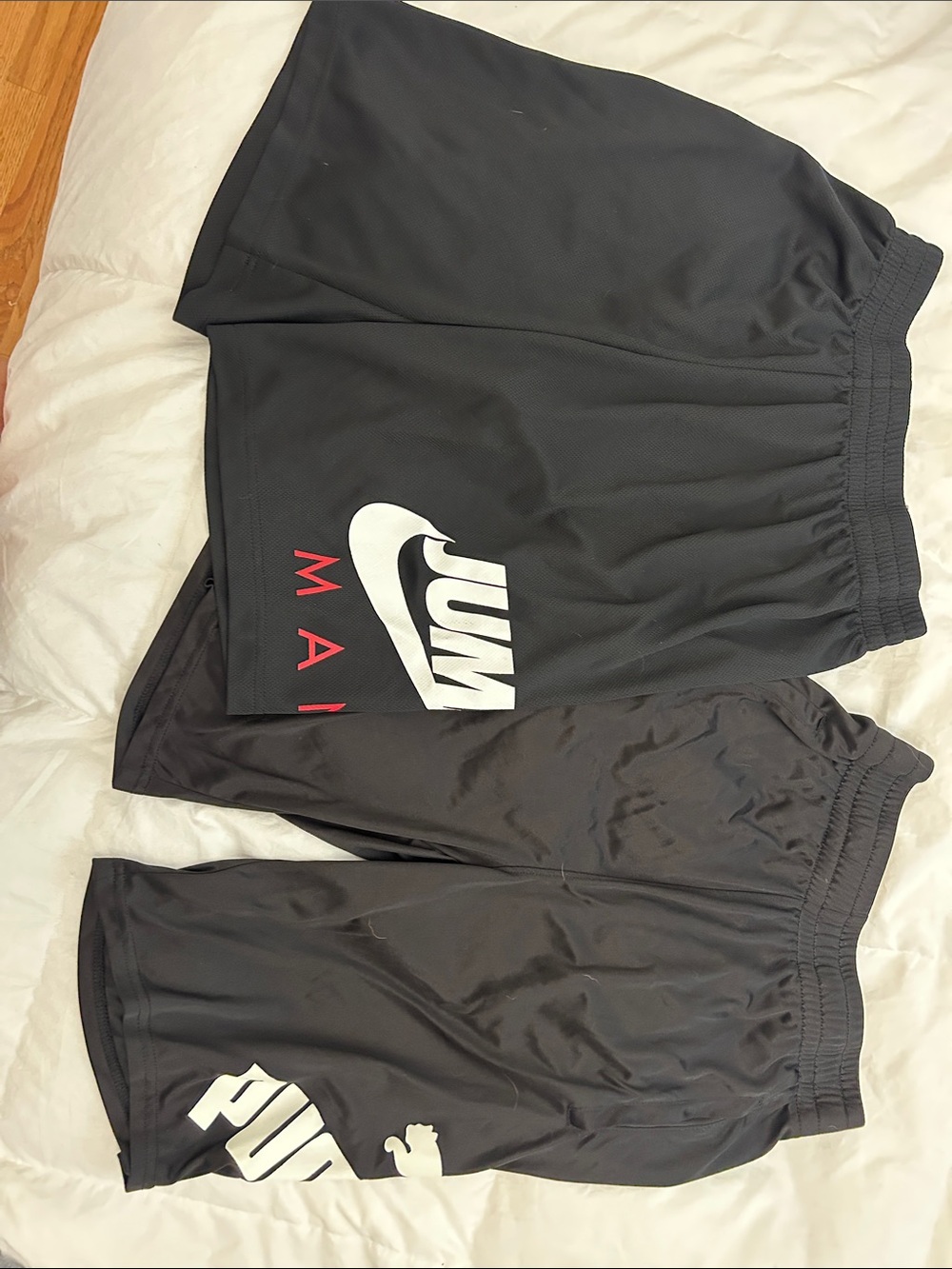 Nike Black Men’s Athletic Shorts with White Logo and Red Accent